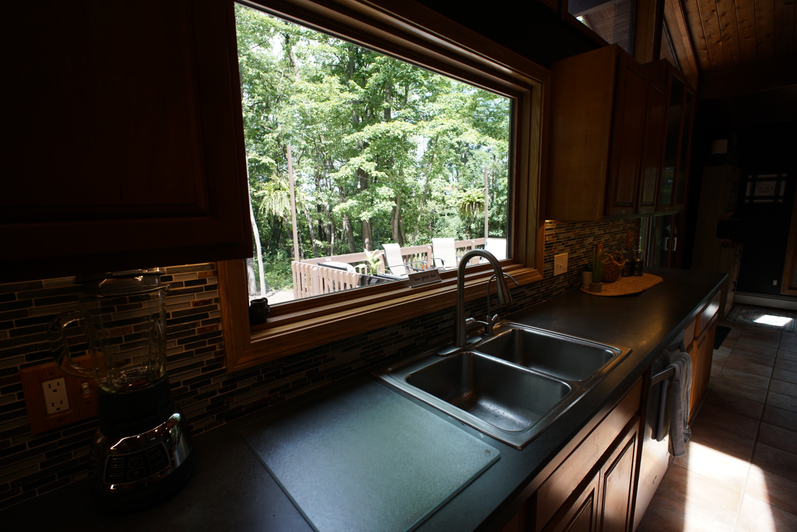 Kitchen with wooded window view