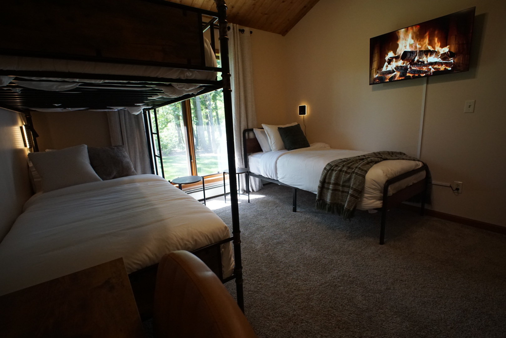Bunk room with wooded view